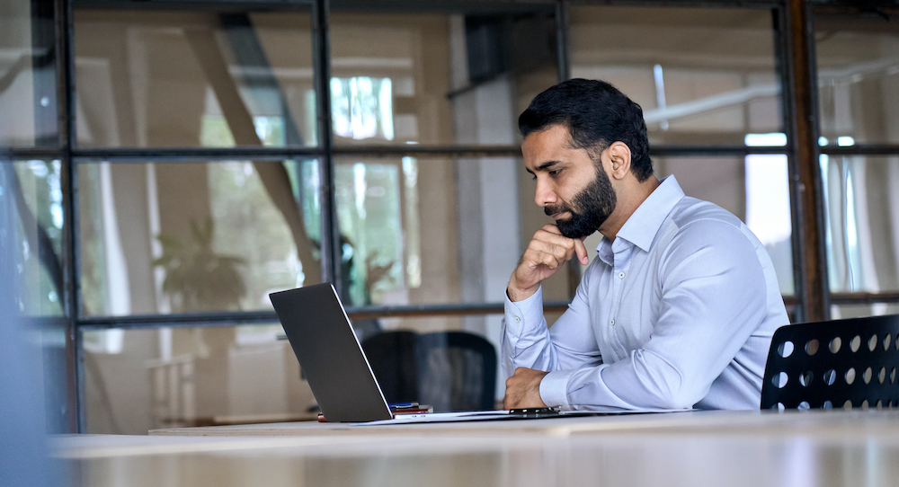indian-businessman-using-laptop-computer-working-i-2021-11-08-16-18-44-utc
